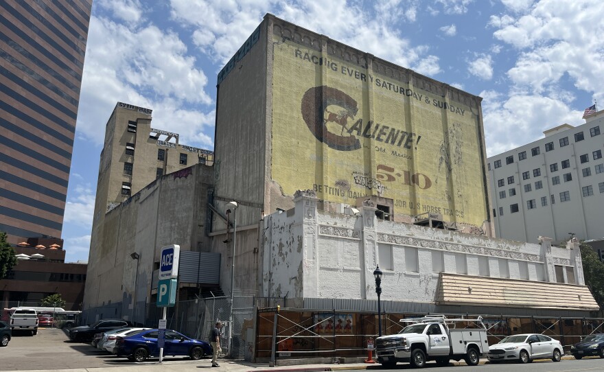 The exterior of the California Theatre building in downtown San Diego displays an old mural on the side of the building, Aug. 22, 2025.