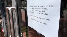 A closed sign at Bubbles Boutique in the Gaslamp Quarters in downtown San Diego on March 16, 2020.