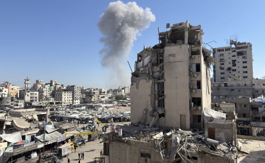 A plume of smoke rises after an Israeli airstrike targeted a home in Gaza City nine months into the ceasefire on July 12, 2026.