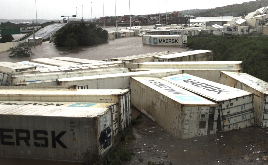 Shipping containers carried away and left in a jumbled pile by floods in Isipingo, south of Durban, South Africa on Tuesday.