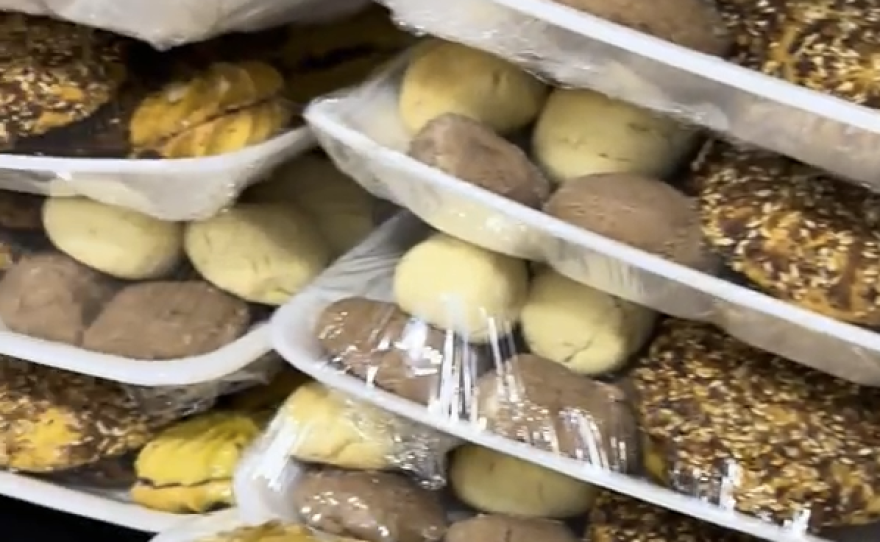 Abu Hani struggles to find ingredients and buys black-market flour to continue to bake for customers in Gaza.