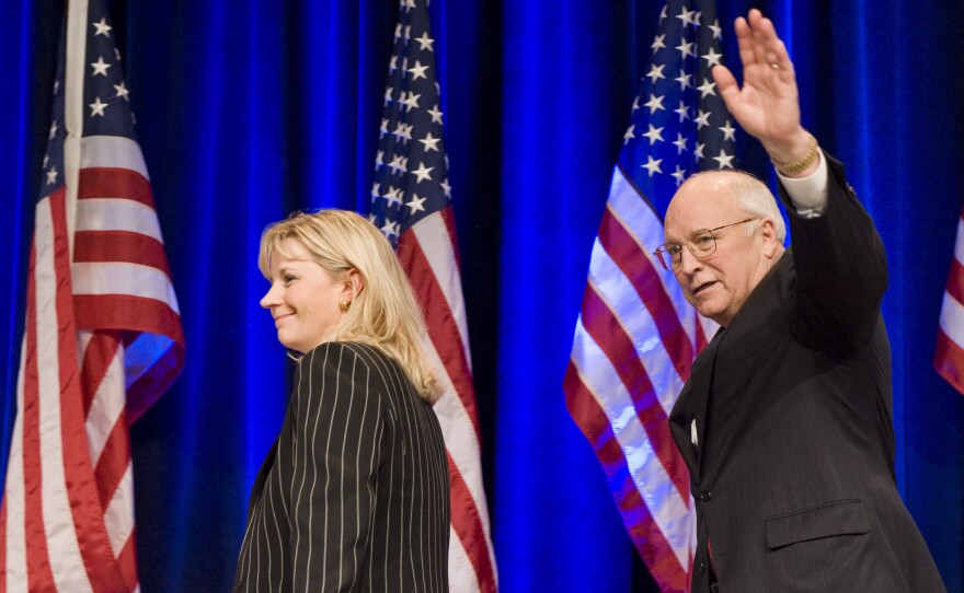 Liz Cheney walks off the stage with her father, former Vice President Dick Cheney, after addressing the Conservative Political Action Conference in 2010.