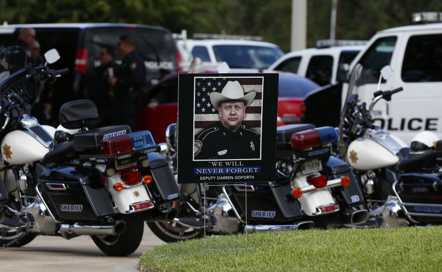 A photo of Darren Goforth is seen near his funeral Friday at Second Baptist Church in Houston, Texas. Deputy Darren Goforth was fatally shot at a gas station last week.