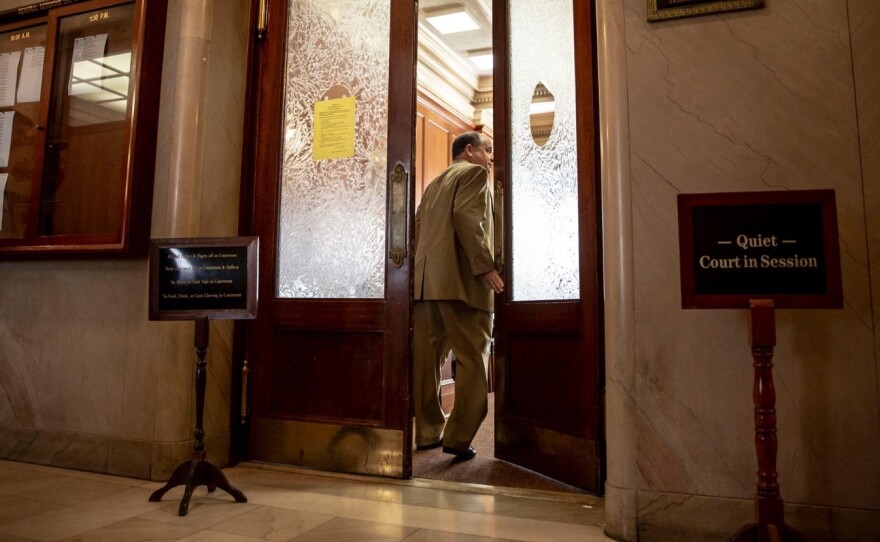 R. Alan Pritchard, one of two attorneys for Methodist Le Bonheur Healthcare, heads into Shelby County General Sessions Court Wednesday in Memphis. He asked the court to drop more than two dozen cases as the hospital reviews its collection policies.