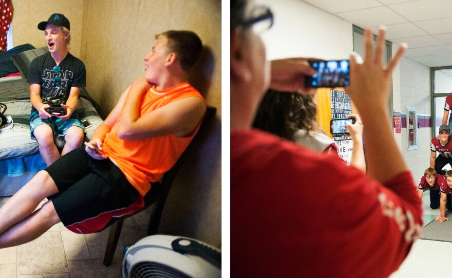 The small team is tight-knit, spending time together both on the field and off. At left, teammates Jayy Morgan, Nick Armour and Jonathon Jacoby play video games at Jacoby's home at Dakotaland Lodging, a trailer court mostly populated by workers and families lured to the Bakken by the area's healthy economy. At right, the team forms a human pyramid in the school's hallway between classes.