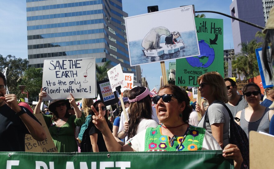 Yolanda Gonzalez, a sixth-grade teacher of Pomona, Calif., demonstrates as part of the March for Science in downtown Los Angeles.