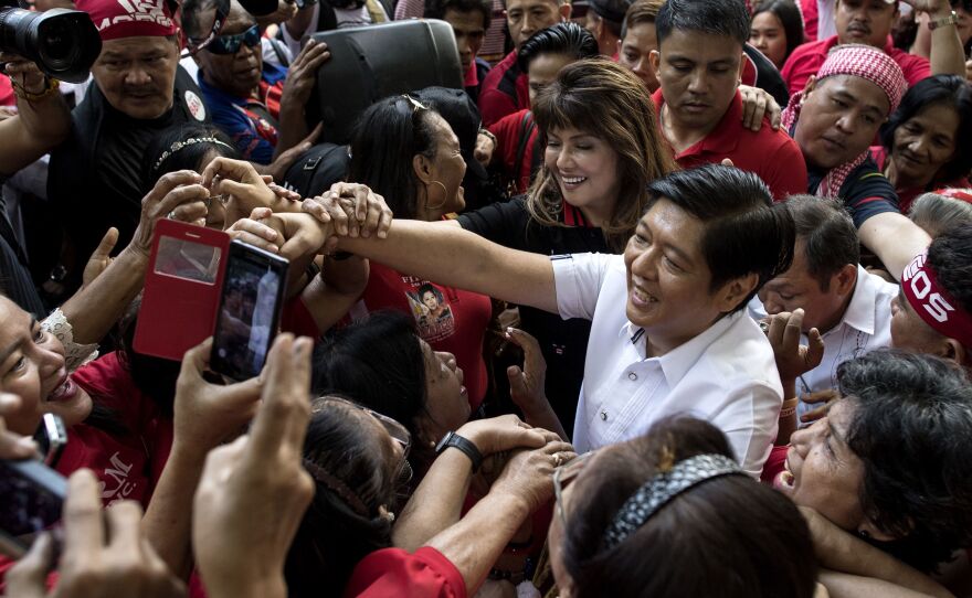 Ferdinand "Bongbong" Marcos Jr. is surrounded by supporters after attending the recount of votes in the 2016 vice presidential race at the Supreme Court. Marcos narrowly lost that contest to Leni Robredo, the current vice president.