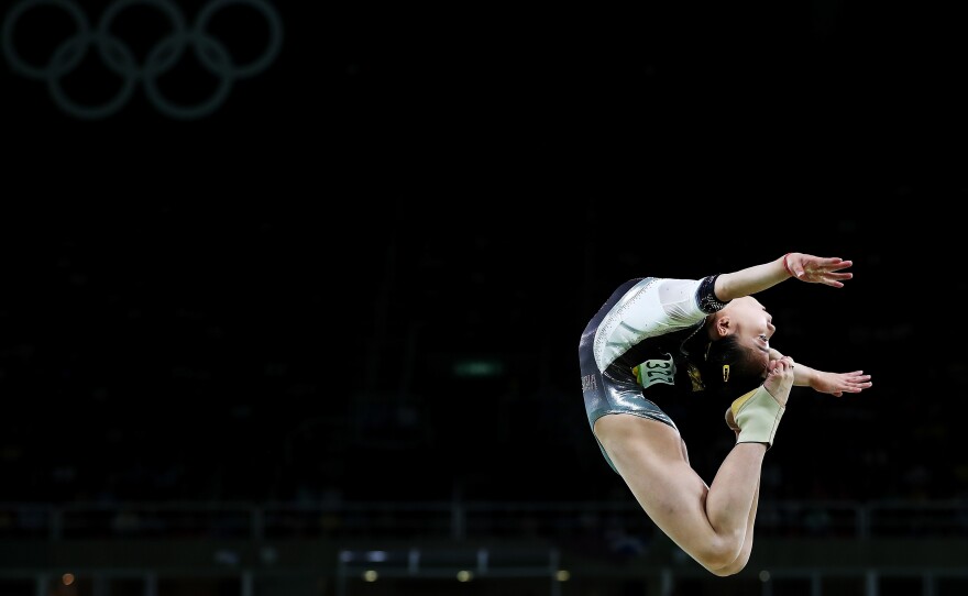 Yan Wang of China in a backbend above the balance beam on Thursday.