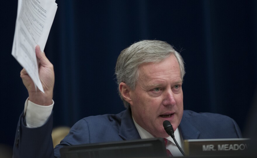 Rep. Mark Meadows, R-N.C., questions Michael Cohen, President Trump's former lawyer, as Cohen testifies before the House oversight committee on Wednesday. Meadows had a heated exchange with Rep. Rashida Tlaib, D-Mich., during the hearing.