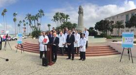 San Diego city and county officials speak at a press conference on the city's hepatitis A outbreak, Sept. 19, 2017. 