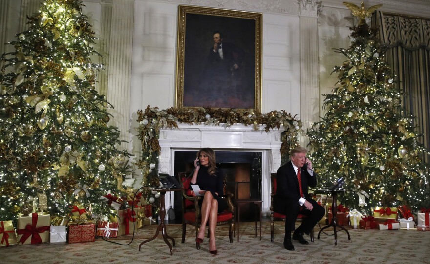 President Donald Trump and first lady Melania Trump speak on the phone sharing updates to track Santa's movements from the North American Aerospace Defense Command (NORAD) Santa Tracker on Christmas Eve.