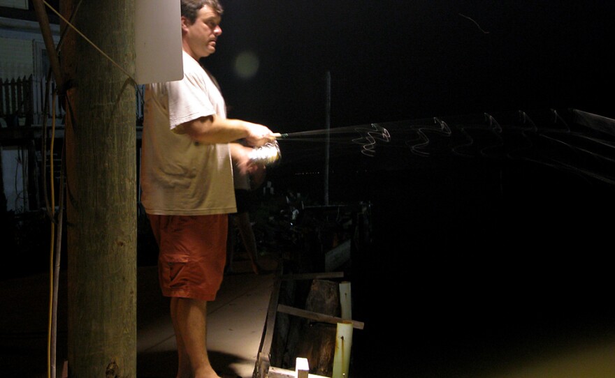 Bryan Casey does a bit of night fishing in an undisclosed location near Grand Isle, La.