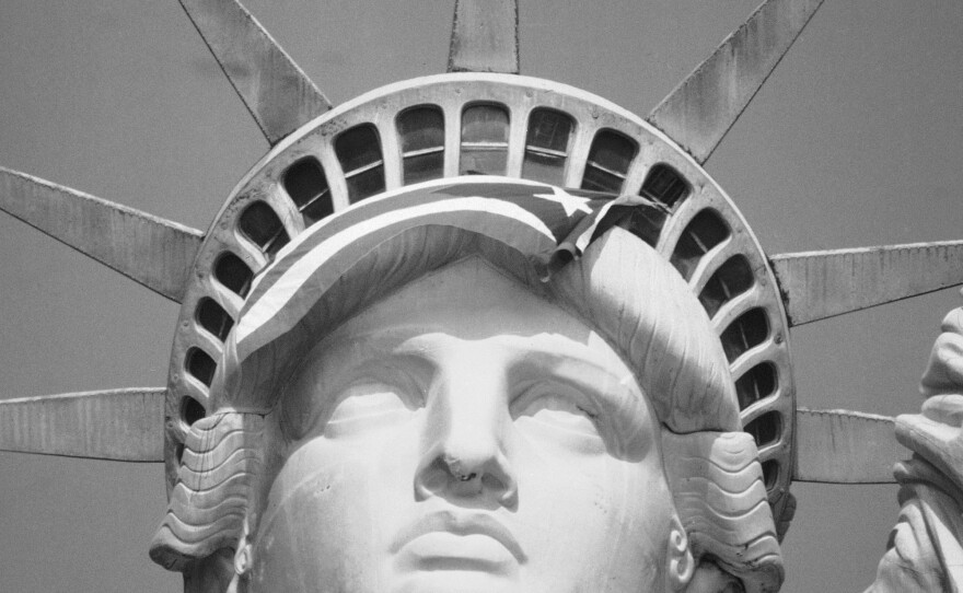 The Puerto Rican flag is draped across the crown of the Statue of Liberty on Oct. 25, 1977, after demonstrators occupied the monument.