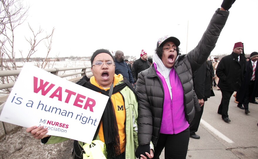 People participate in a national mile-long march in February to highlight the push for clean water in Flint, Mich.