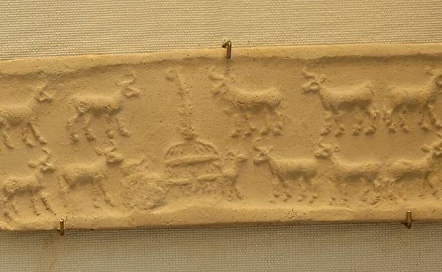 Cylinder seal and impression showing a cattle herd at the cowshed from Mesopotamia in the  Uruk Period (4100 BC–3000 BC).