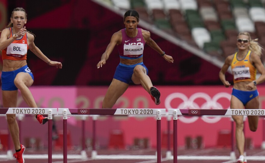 Sydney Mclaughlin, of the United States, wins the women's 400 meter hurdles final at the Summer Olympics in Tokyo.