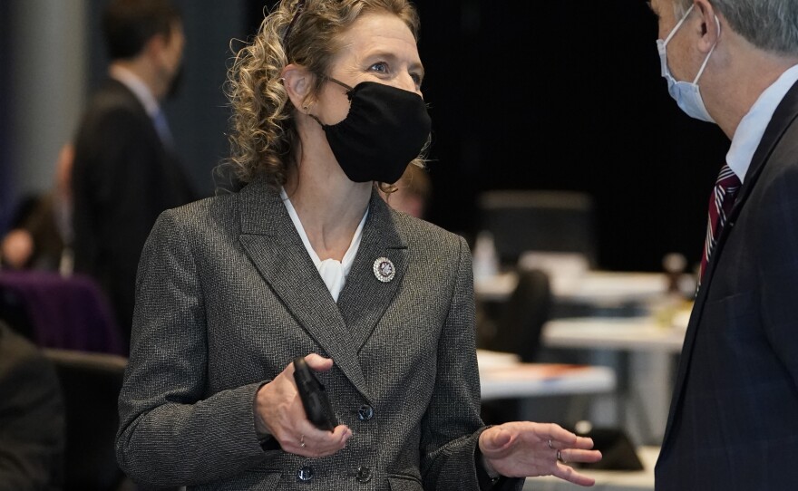 Virginia State Sen. Jen Kiggans, R-Virginia Beach, left, talks with Sen. Mark Obenshain, R-Rockingham, during the Senate session at the Science Museum in Richmond, Va. in Feb. 2021