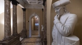 A statue of Benjamin Franklin is seen in an empty corridor outside the Senate at the Capitol in Washington, Thursday, Dec. 27, 2018, during a partial government shutdown.