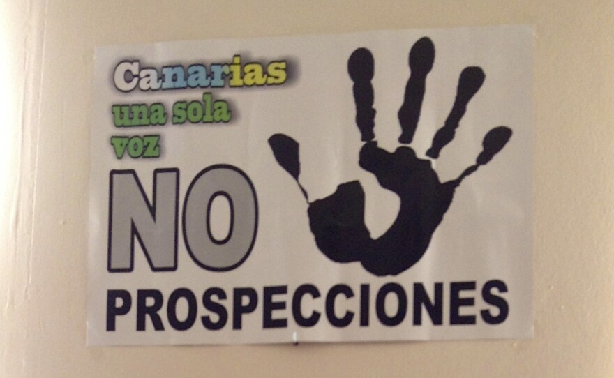 Local activists have printed posters in several languages (here shown in Spanish, Arabic and German) to try to convince tourists and locals to oppose oil drilling in the Canary Islands.