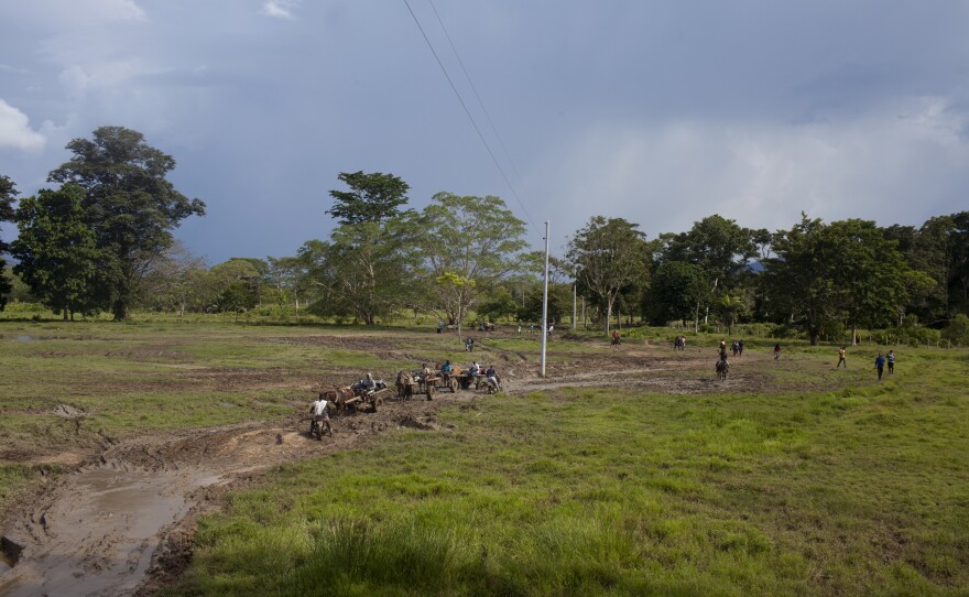 Before entering the jungle many migrants hire motorcycles or horse carts to take them over grassy trails to where the jungle begins.