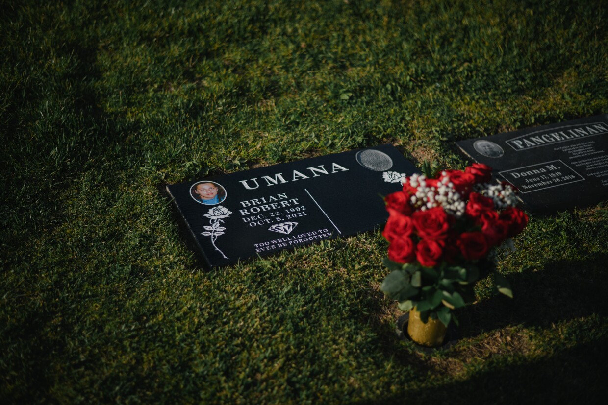 The setting sun illuminates Brian Umana's gravestone at a cemetary in San Diego, California is seen on April 23, 2025. After a three year-legal battle, Brian's family and their attorneys won a $1 million settlement from National City for his 2021 killing by police.