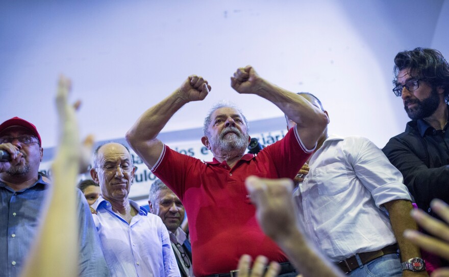 Brazilian prosecutors are seeking the arrest of former President Luiz Inacio Lula da Silva, shown here during a during a rally on March 4 in Sao Paulo. He is accused of corruption and embezzlement.