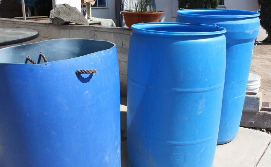 The Colunga family has been carrying water in barrels from neighbors and relatives to use for washing since their well went dry.