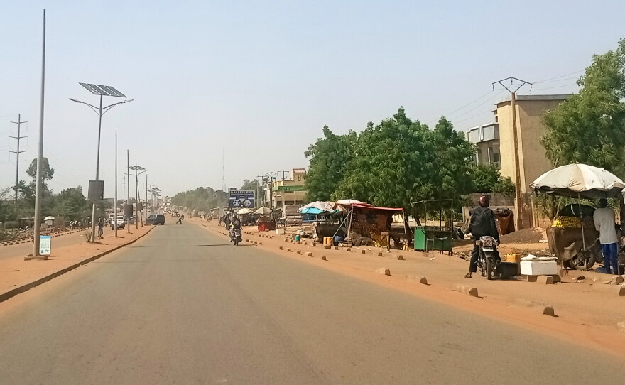 FILE - Motorcyclist ride along a street in Niamey, Niger, Thursday, June 18, 2026.