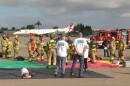 A JSX plane on the runway in the background as emergency crews conduct a disaster drill at McClellan-Palomar Airport, Oct. 23, 2025.