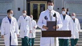 Dr. Sean Conley, physician to President Donald Trump, and other doctors, arrive to brief reporters at Walter Reed National Military Medical Center in Bethesda, Md., Sunday, Oct. 4, 2020.