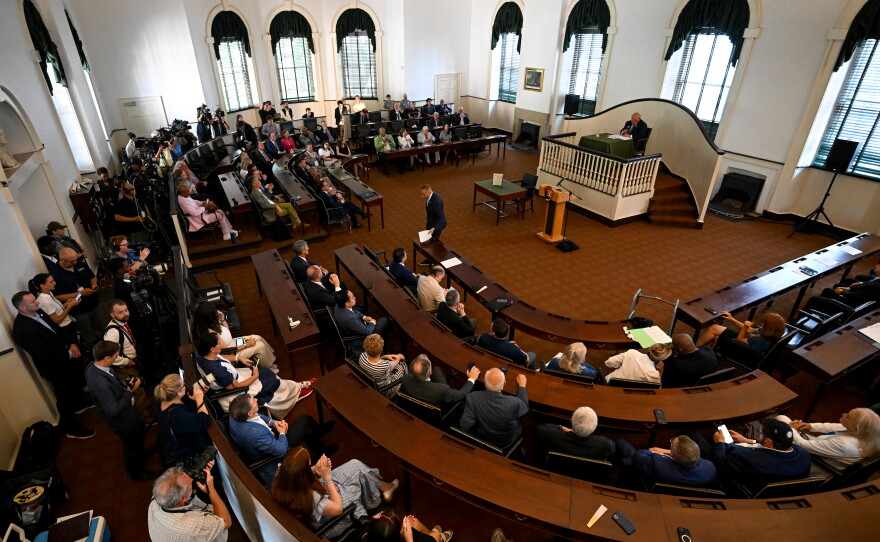 House Minority Leader Hakeem Jeffries returns to his seat after delivering remarks during a ceremonial gathering of members of Congress at Independence Hall.