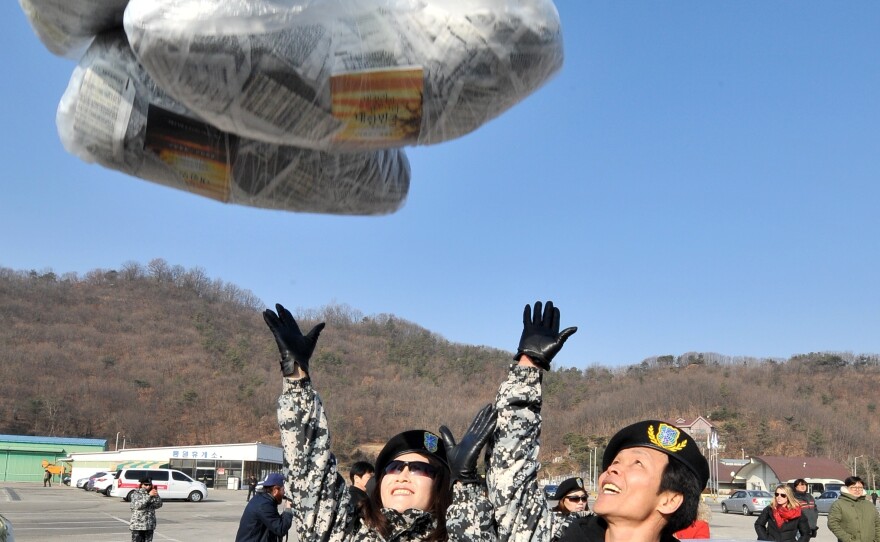 Former North Korean defectors release a balloon carrying anti-North Korea leaflets in the border town of Paju, north of Seoul, in January 2014. Activists launch thousands of anti-Pyongyang leaflets and Wikipedia-loaded USB keys across the border.