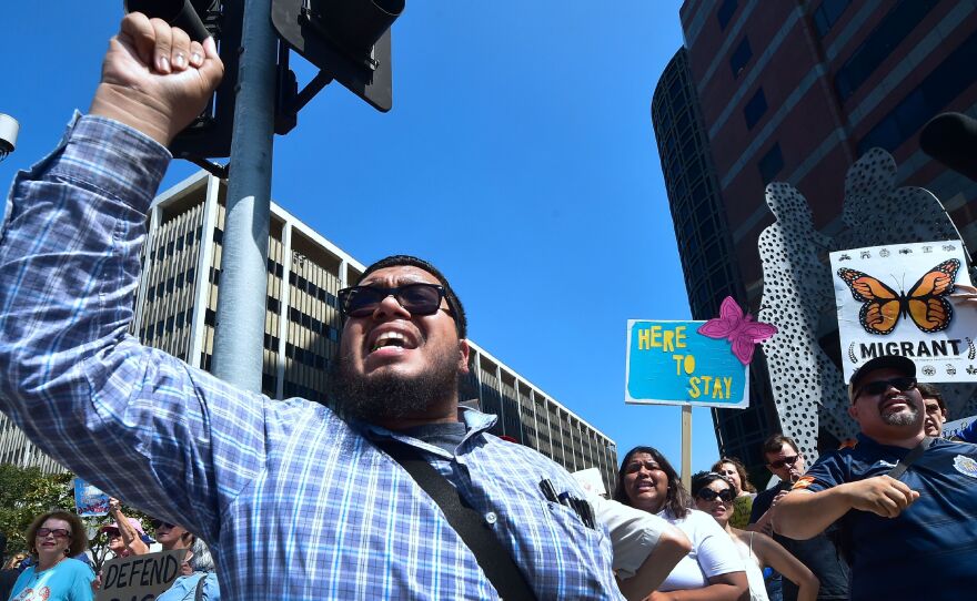 A supporter of the Deferred Action for Childhood Arrivals (DACA) in Los Angeles protests the Trump administration's decision to end the program.