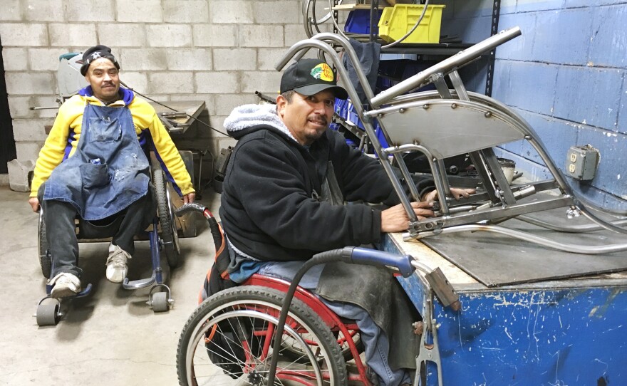 Gabriel Zepeda (right) makes an all-terrain wheelchair. He's been making wheelchairs for low-income Mexicans for 27 years.