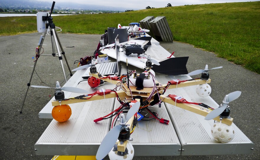 Hi-tech hobbyists Andreas Oesterer and Mark Harrison line up their homemade drones in Berkeley, Calif.