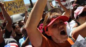 Opponents of Arizona's controversial immigration-enforcement law protest outside the state capitol building in Phoenix last April. Arizona officials recognize both the need for a new tone and the fact that such efforts could prove short-lived in a state where politics have grown more polarized in recent years.