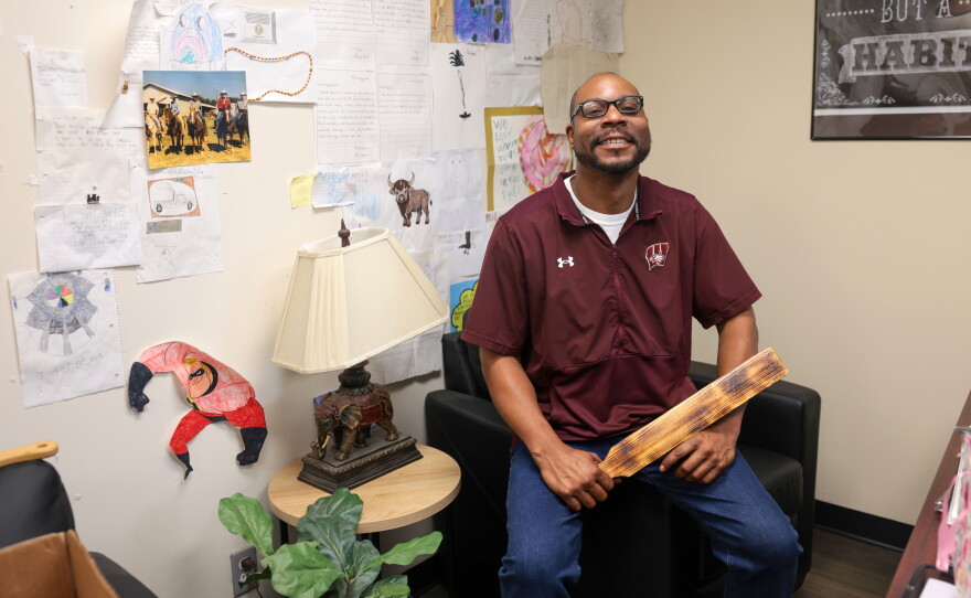 Warner Public Schools' elementary principal, Alan Gordon, holds one of his paddles in his office. Gordon said a student only receives a paddling after they have been sent to his office multiple times and have served lunch detention for the same infraction.