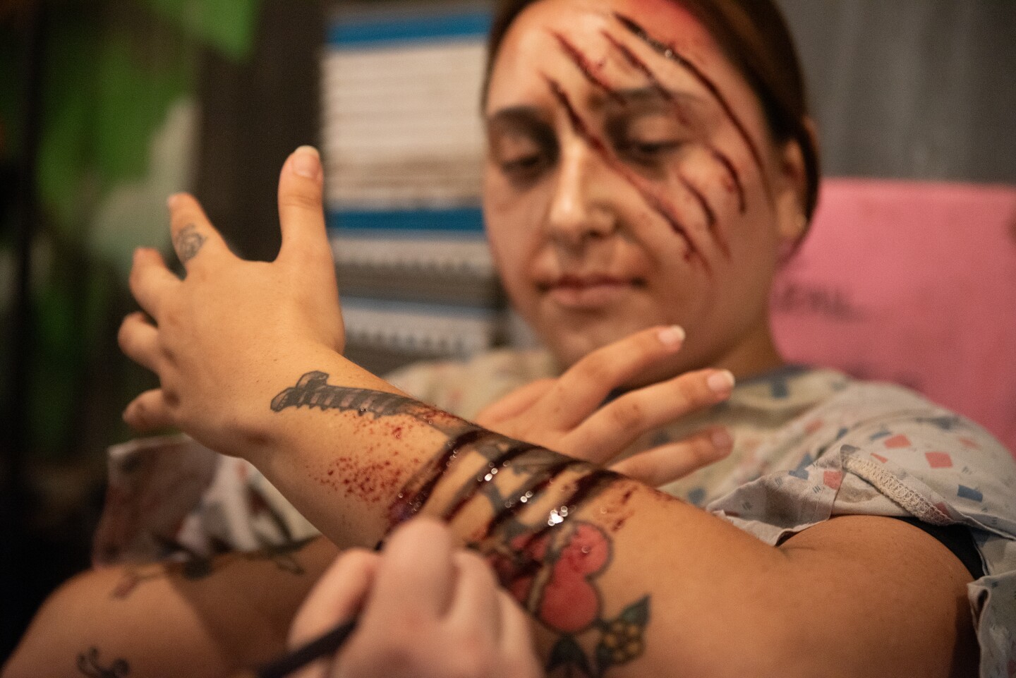 Jazmin Alas gets bloodied up for her wat The Haunted Trail in Balboa Park on Sept. 25, 2025.