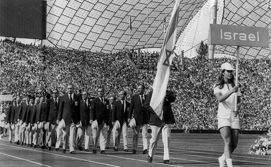 Israeli athletes walk into the stadium with their flag at the Munich Summer Olympics, 1972, Munich, Germany.