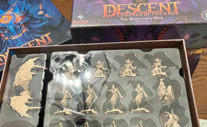 Descent's giant boxes and the dozens of miniatures contained therein.