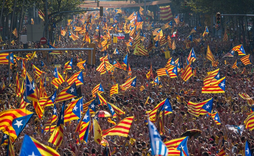 Demonstrators who support independence for Catalonia march in a Sept. 11 rally in Barcelona, Spain. Sunday's vote on independence is nonbinding.