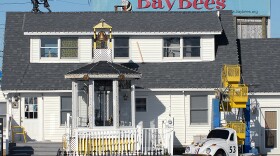 The "BayBees" children's pediatrics office of Dr. Earl Bradley is shown, above, weeks after Bradley was accused of molesting dozens of children at his practice, and, below, after workers removed the signs and attractions, which included a mini-Ferris wheel and carousel.