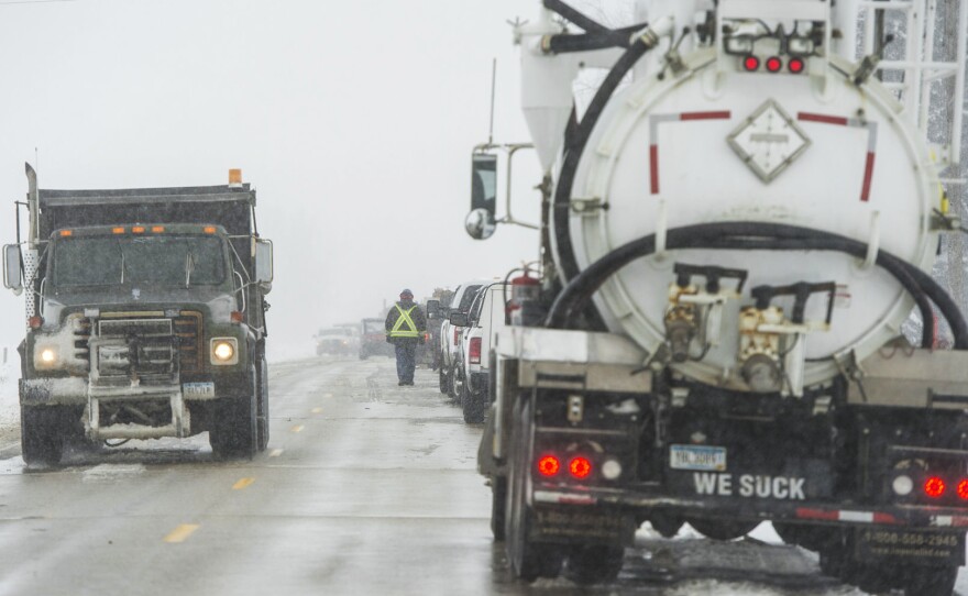 Crews clean up the diesel fuel spill after a pipeline broke in Worth County, Iowa on Wednesday.