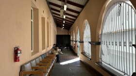 People sit in the chairs lining the alcove of the Father Joe's Villages day center on Oct. 14, 2026.