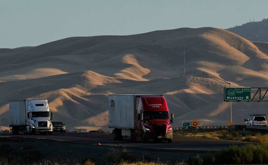 Freight trucks travel northbound on Interstate 5 Highway in September 2025, in Tracy, Calif.