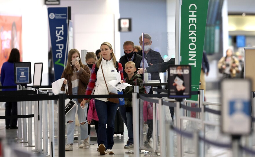 Airline passengers prepare to enter a security checkpoint at San Francisco International Airport on April 19.