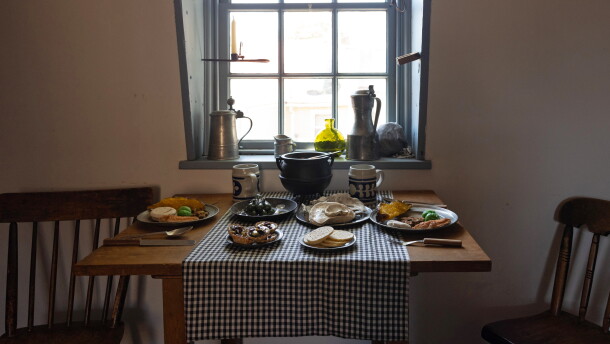 A table setting depicting a typical working-class meal in 18th century Annapolis is displayed at Hogshead Trades Museum in Annapolis.