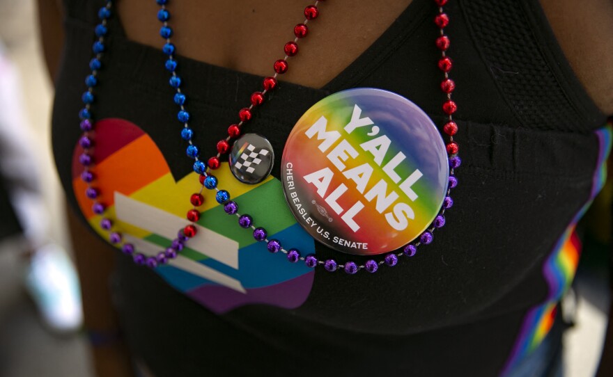 A woman wears a button during celebrations for Pride month on June 25, 2022, in Raleigh, North Carolina.