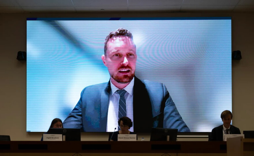 Board Member Rhys Williams appears on a screen during a California Environmental Protection Agency Board of Environmental Safety meeting at CalEPA headquarters in Sacramento on July 23, 2026. Williams attended the meeting virtually.