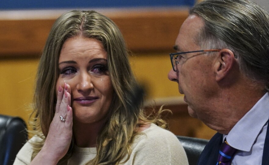 Jenna Ellis speaks with her attorney Franklin Hogue in an Atlanta court on Tuesday after pleading guilty to a felony count of aiding and abetting false statements and writing.